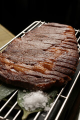 Medium rare sliced grilled striploin beef steak
