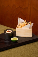 Battered fish with sauce lime and seaweed