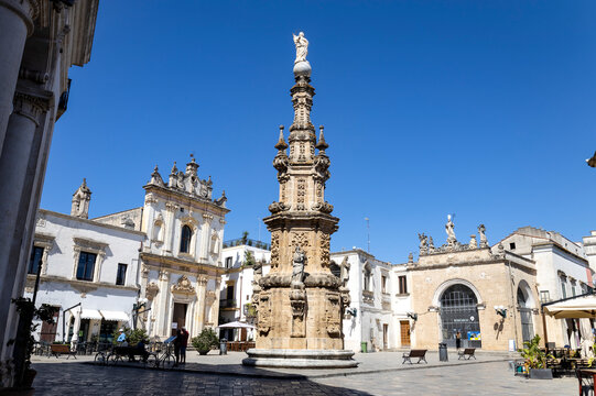 NARDO', ITALY, JULY 17, 2022 - View of the church of Saint Tryphon (San Trifone) and the Spire of the Immaculate  in the center town of Nardò, province of Lecce, Puglia, Italy