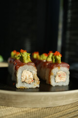 Sushi roll with salmon and shrimps on a sushi tray