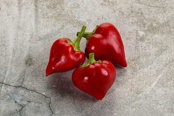 Red spicy cherry pepper heap