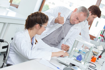 team of scientists in a laboratory working on chemical testing