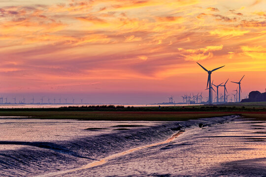 Wind farm along the river Ems mudflats, East Frisia, Lower Saxony, Germany
