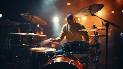A musician holding a drum stick is playing a song. Music program. Concert stage background.