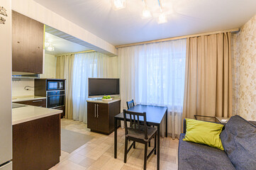interior apartment kitchen and dining room, refectory area, cooking equipment, table furniture, stove