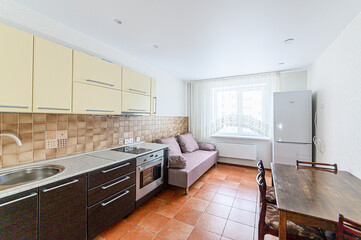 interior apartment kitchen and dining room, refectory area, cooking equipment, table furniture, stove