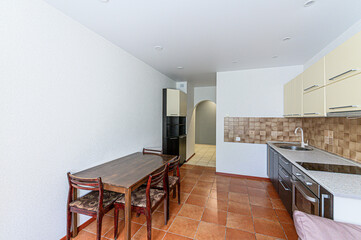 interior apartment kitchen and dining room, refectory area, cooking equipment, table furniture, stove