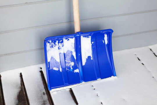 Blue snow plastic shovel for area cleaning