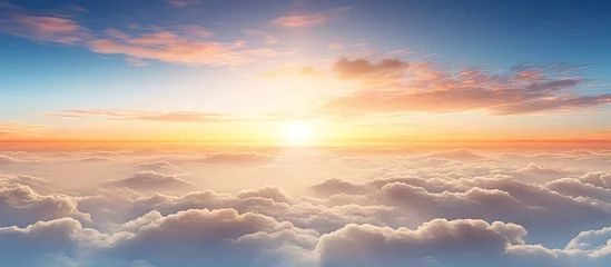 Foto op Plexiglas Mistige ochtendstond Bird s eye view of dynamic sunset over thick white clouds with far off mountains on the horizon With copyspace for text