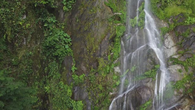 Aerial ascent of beautiful Cascada el Bejuco waterfall in Honduras