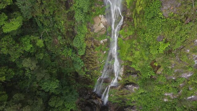 Aerial looks down onto Cascada el Bejuco waterfall on Honduras cliff