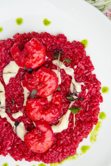 shrimp with beans and herbs in red sauce, top view