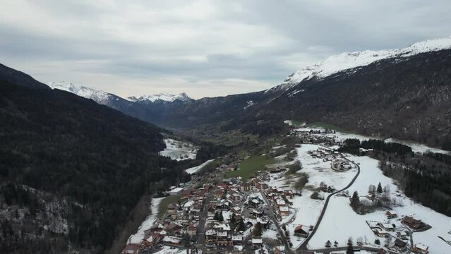 Aerial and city view of a village next to a ski resort