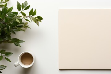 Blank notebook with white sheets and plant on a white table. Business concept