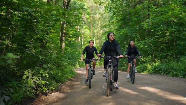 Sport Activity And Healthy Lifestyle, Three Happy Young Women Riding Bicycles In Forest, Active Rest