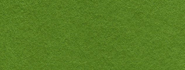 Texture of dark green and olive colors paper background, macro. Structure of dense lime craft...