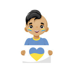 A boy is holding a poster with the image of the Ukrainian flag in the shape of a heart