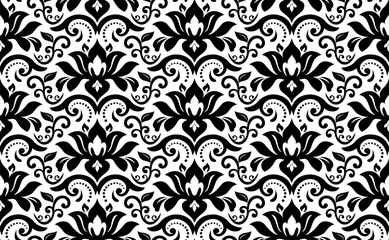 Floral vector black and white ornament. Seamless abstract classic background with flowers. Pattern with repeating floral elements. Ornament for wallpaper and packaging