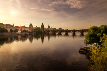 Autumn views from Prague. Picturesque autumn Prague in the morning sun. The Vltava River with the Charles Bridge, the waterfront and houses of Mala Strana and the dominant Prague Castle. Czechia