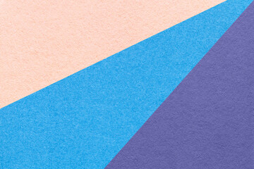 Fototapeta premium Texture of old craft coral, blue and violet color paper background, macro. Structure of vintage abstract cardboard