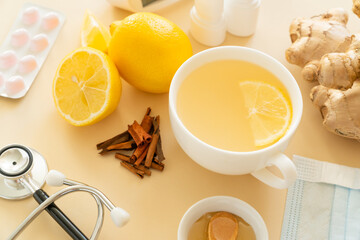 Natural cold remedies concept - ginger tea and ingredients, drugs, thermometer - obrazy, fototapety, plakaty