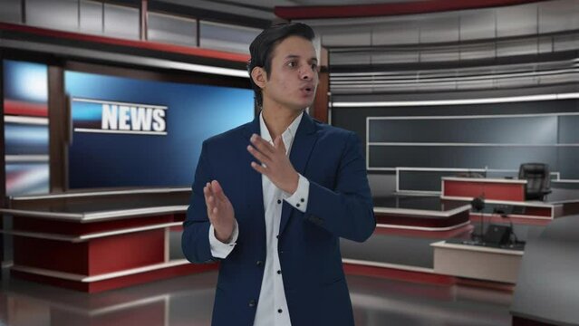 Indian journalist reading news to audience