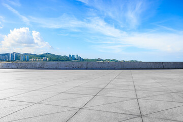 Empty square floors and residential area building with mountain under the blue sky