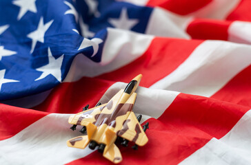 US Air Force Day concept with a retro wooden airplane above the USA flag. 