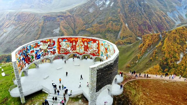 An aerial view of the Russia-Georgia Friendship Monument located on the Georgian Military Road overlooking Devil's Valley in the Caucasus. Gudauri. Georgia.