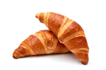 Fresh croissants on a white background closeup. French pastries - 662677772