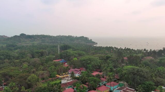 Goa, India: Aerial view of famous Indian summer resort by Arabian Sea, famous Sinquerim Beach and Sinquerim Fort at sunset - landscape panorama of South Asia from above