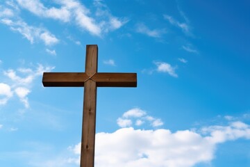 a wooden cross against a blue sky