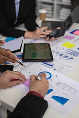 Vertical images, charts and income graphs using a laptop computer. Business analysis and strategy concepts Meet with a business advisor and discuss finances, close-up photo