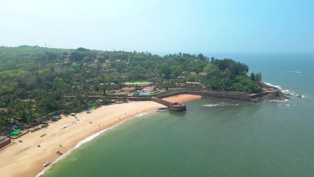 Goa, India: Aerial view of Indian summer resort by Arabian Sea, famous Sinquerim Beach and Sinquerim Fort - landscape panorama of South Asia from above