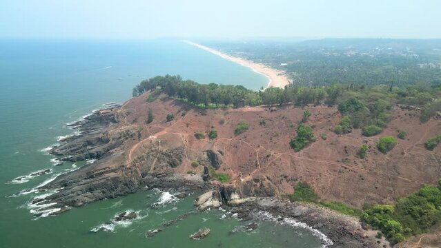 Goa, India: Aerial view of Indian summer resort by Arabian Sea, famous Sinquerim Beach and Sinquerim Fort - landscape panorama of South Asia from above