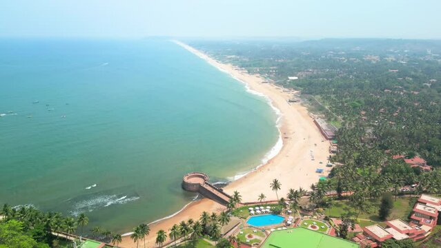 Goa, India: Aerial view of Indian summer resort by Arabian Sea, famous Sinquerim Beach and Sinquerim Fort - landscape panorama of South Asia from above