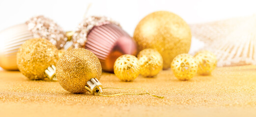 Pile of bright Christmas gold baubles. Christmas spirit.