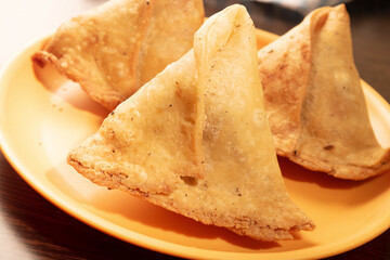 Closuep of samosa plate at table