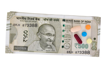 Indian currency note with medicine isolated on white background with cutout