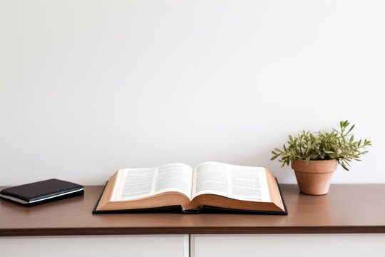 an opened scripture on a minimalist desk setup