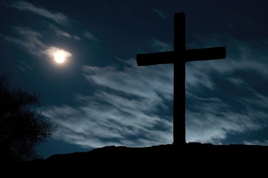 an ominous silhouette of a cross against a moonlit sky