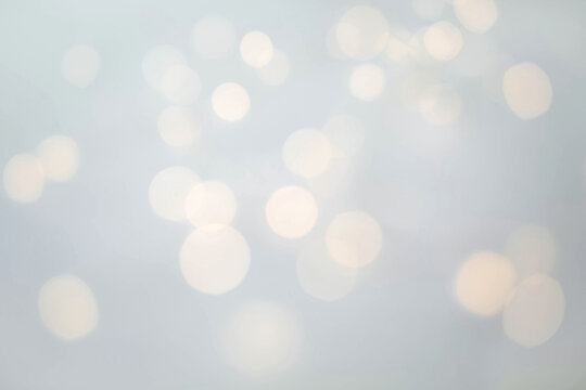 Abstract festive grey background on the theme of Christmas or New Year with bokeh in blurry focus.