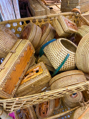 Household appliances, including baskets, tissue holders, placemats, and ornaments made of rattan at handicraft exhibitions.