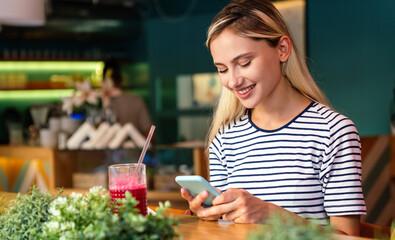 Portrait og happy woman using mobile phone for work, study or social media. People technology
