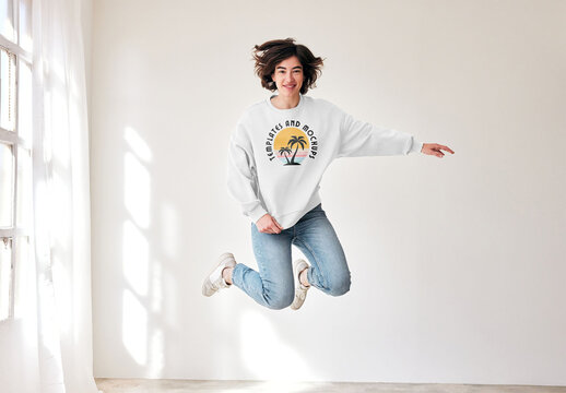 Mockup of woman wearing customizable sweatshirt jumping