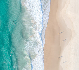 Aerial split view of the ocean and a beach