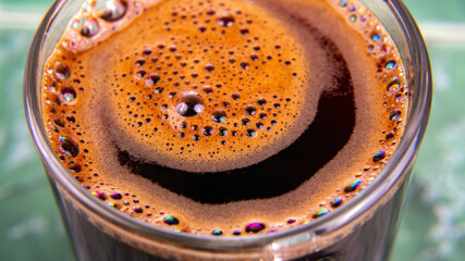 freshly brewed coffee in a Cup close-up