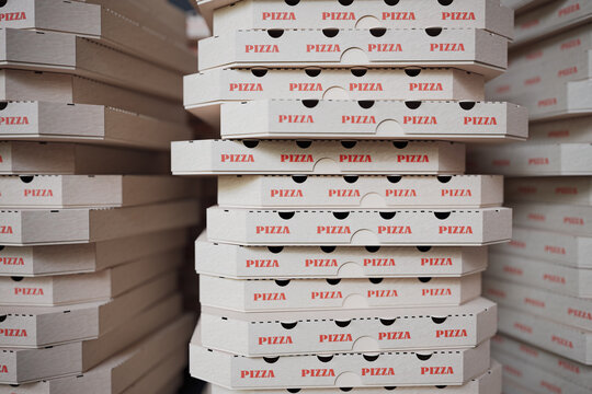Many cardboard pizza boxes. 3D rendered illustration.