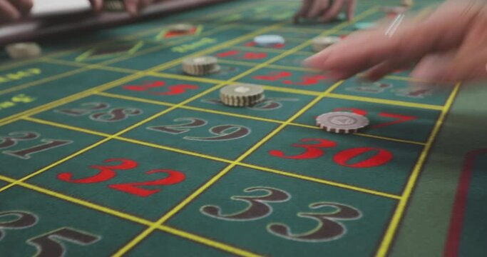 Roulette players make a bet. Casino players make a bet. A roulette player places chips on the game table