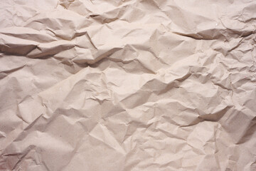 Texture of brown crumpled craft paper, full frame